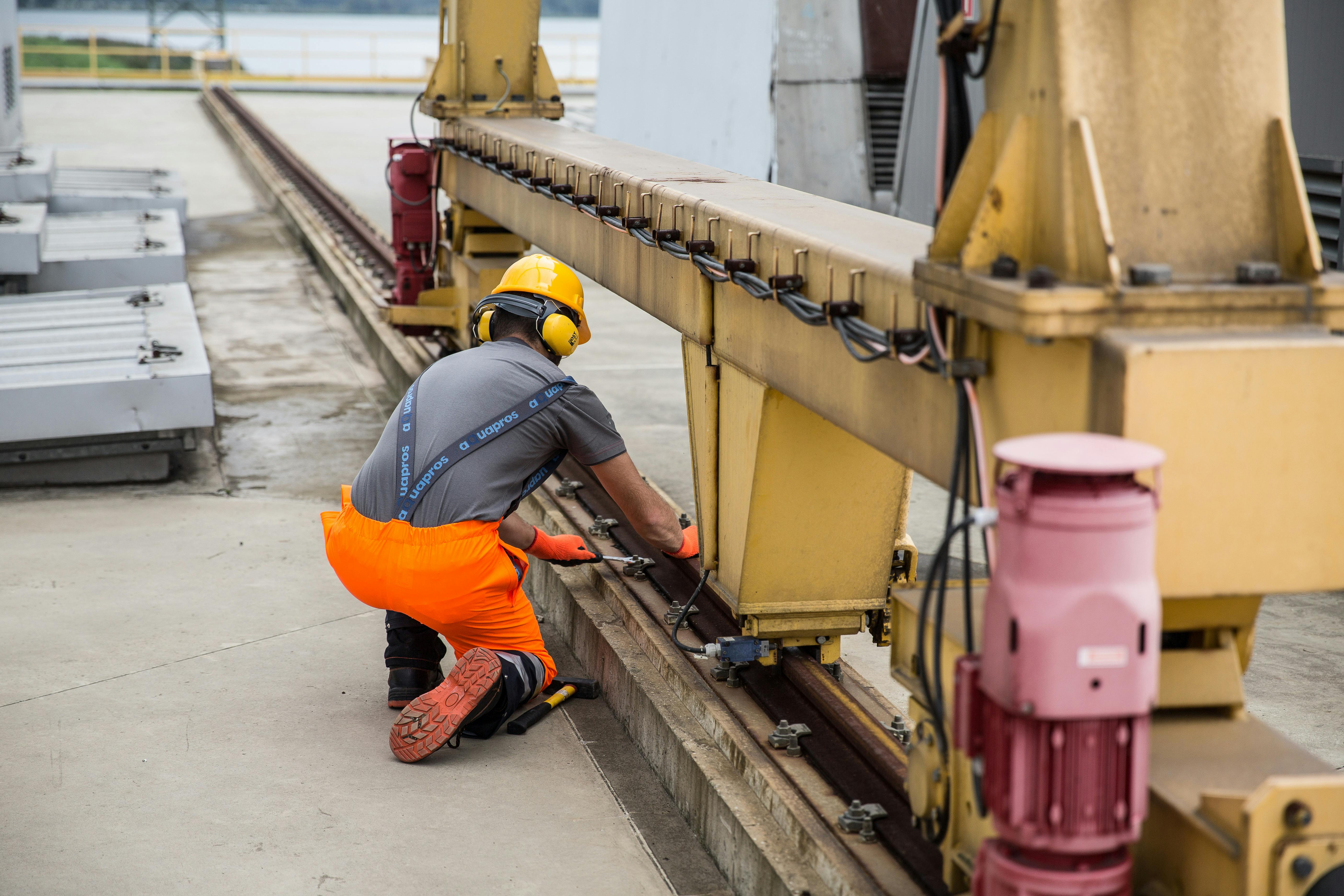 Technician servicing industrial mechanical equipment